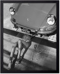 Poster Master Woman Under Classic Car Poster by PosterMaster